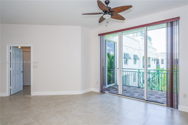 unfurnished room with baseboards and a ceiling fan