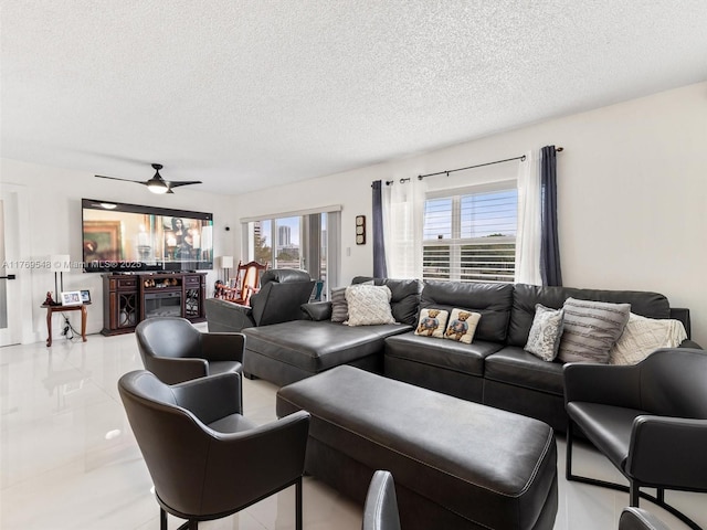 200 Diplomat Pkwy Unit 424, Hallandale Beach, FL 33009 - tiled living room with a textured ceiling and a ceiling fan