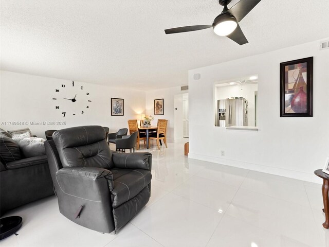 200 Diplomat Pkwy Unit 424, Hallandale Beach, FL 33009 - living room featuring visible vents, ceiling fan, light tile patterned floors, and a textured ceiling