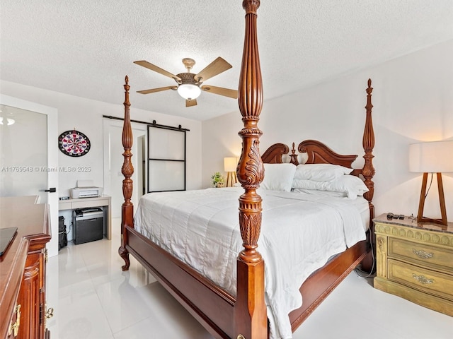 200 Diplomat Pkwy Unit 424, Hallandale Beach, FL 33009 - bedroom featuring a textured ceiling and ceiling fan