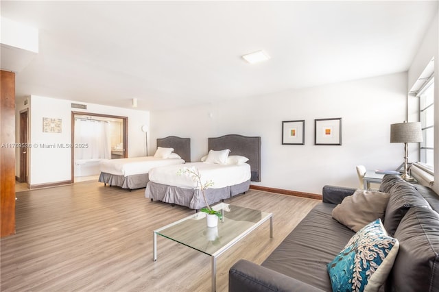 1024 Ocean Dr Unit A404, Miami Beach, FL 33139 - bedroom featuring light wood-style flooring and baseboards