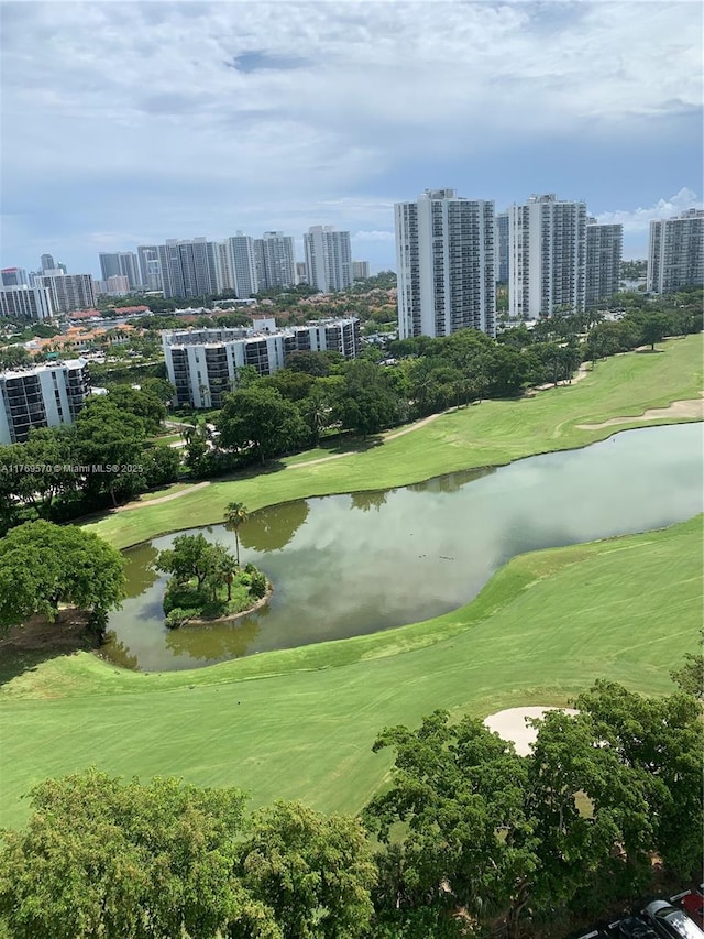 view of community featuring view of golf course, a water view, and a view of city