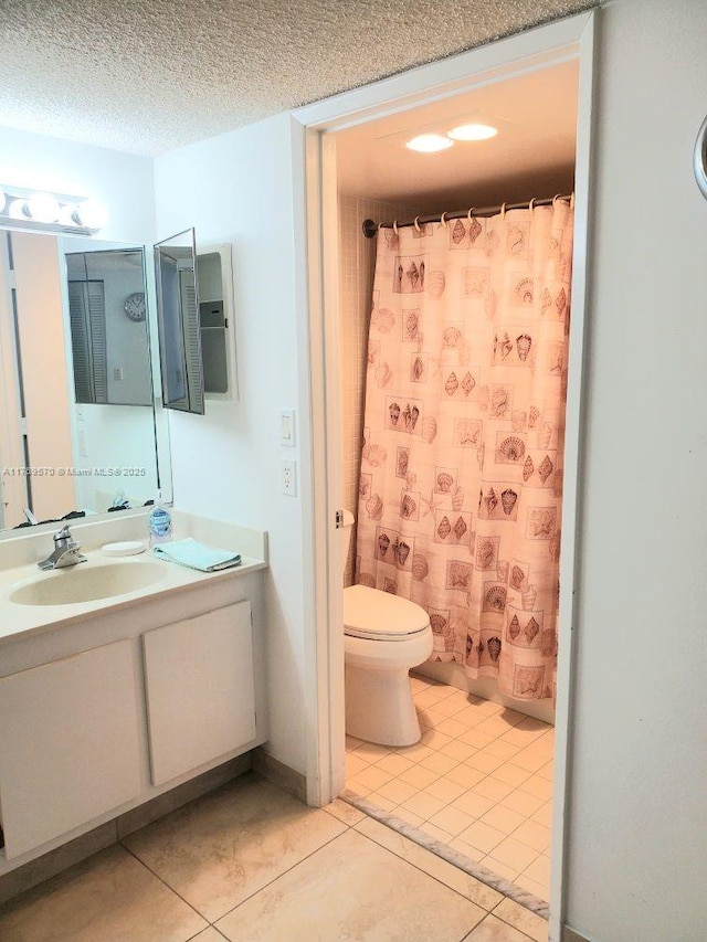 full bathroom featuring a textured ceiling, toilet, vanity, a shower with curtain, and tile patterned flooring