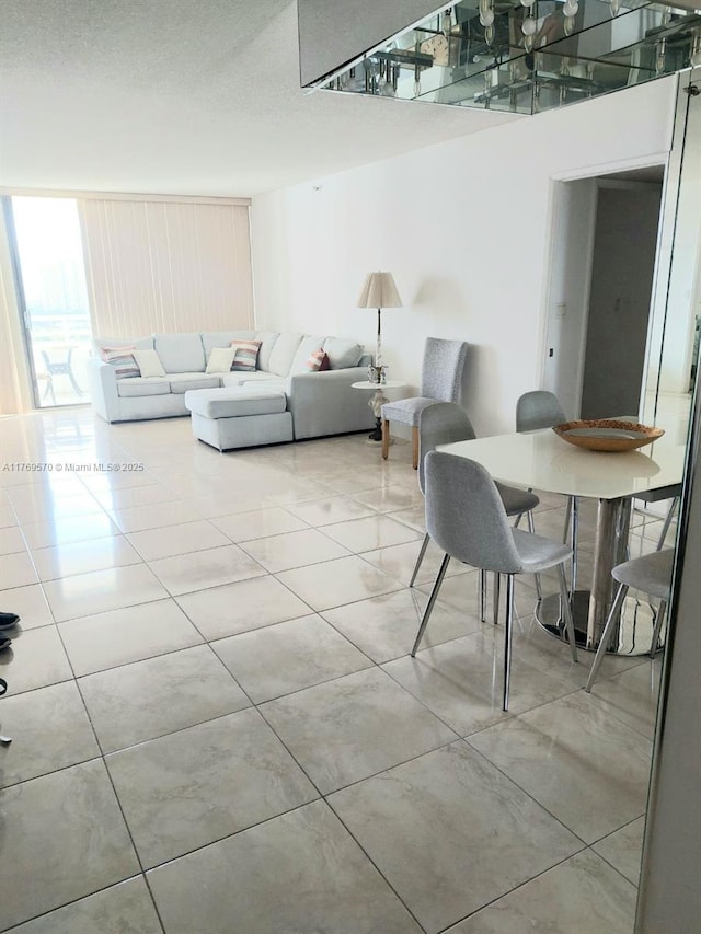 dining space with tile patterned floors
