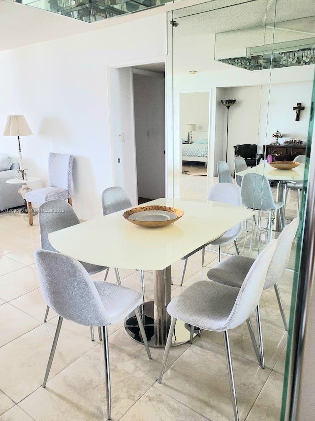 dining space featuring tile patterned floors