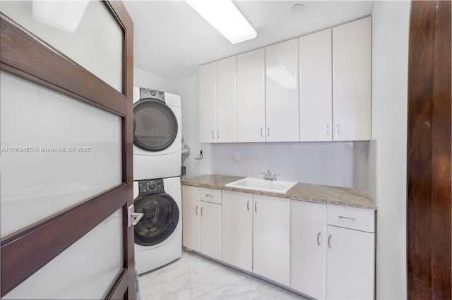 4000 Island Blvd Unit Ph6, Aventura, FL 33160 - washroom featuring cabinet space, a sink, and stacked washing maching and dryer