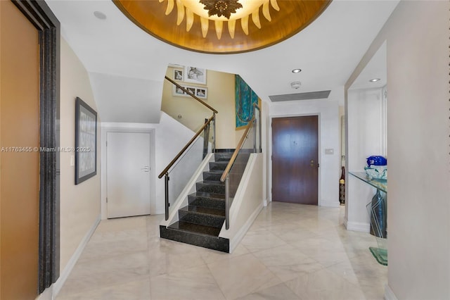 4000 Island Blvd Unit Ph6, Aventura, FL 33160 - entrance foyer with marble finish floor, baseboards, stairway, and a raised ceiling