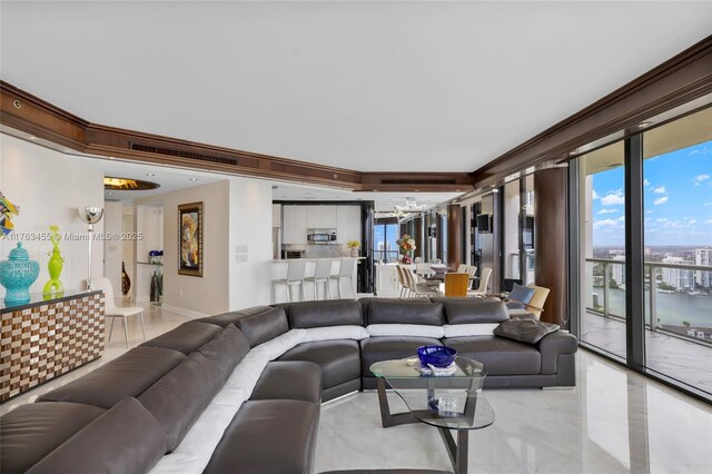 4000 Island Blvd Unit Ph6, Aventura, FL 33160 - living room featuring baseboards, an inviting chandelier, and crown molding