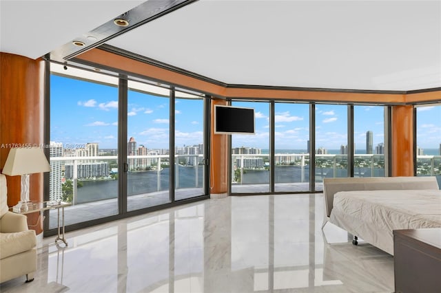 4000 Island Blvd Unit Ph6, Aventura, FL 33160 - bedroom featuring multiple windows, ornamental molding, and access to outside