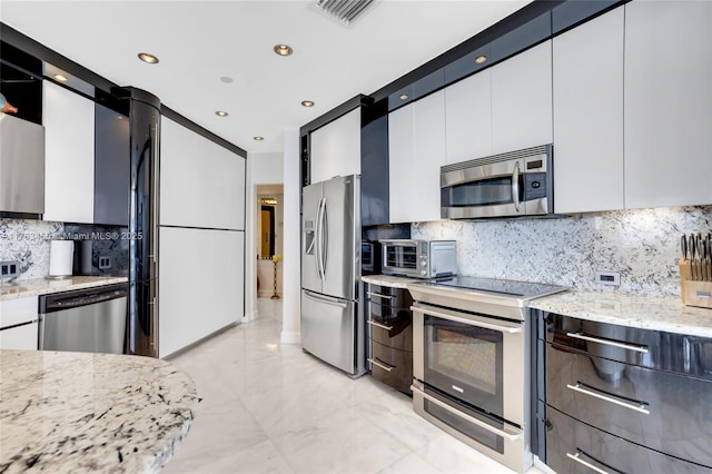 4000 Island Blvd Unit Ph6, Aventura, FL 33160 - kitchen with a toaster, marble finish floor, visible vents, white cabinets, and appliances with stainless steel finishes