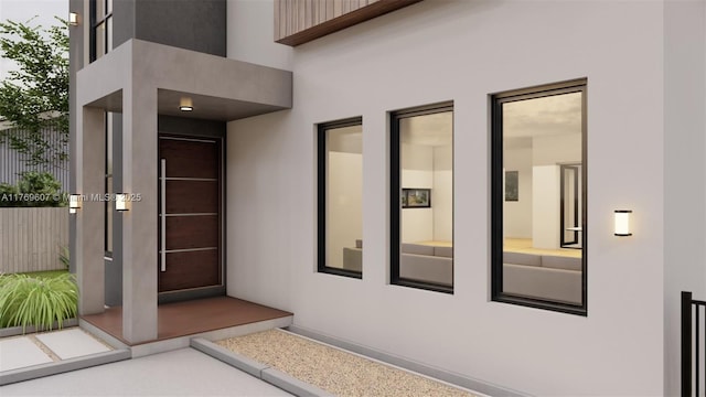 entrance to property with stucco siding