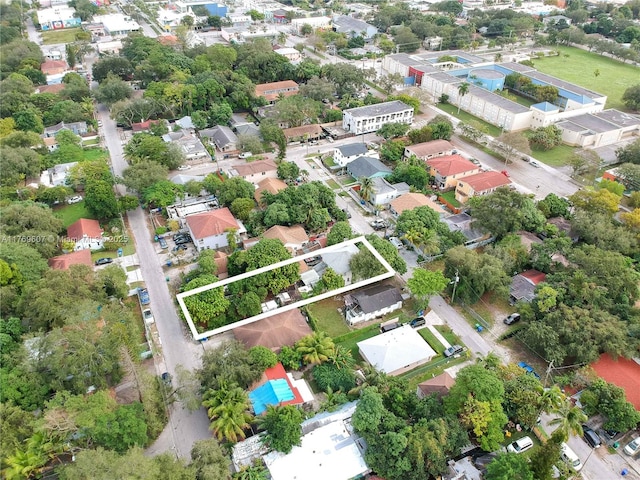 birds eye view of property with a residential view