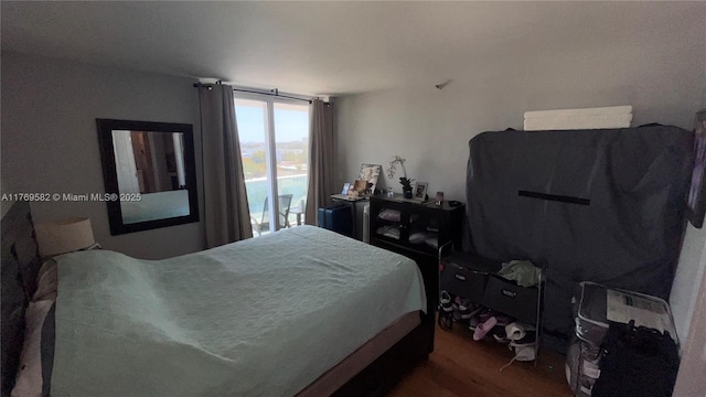 bedroom with wood finished floors
