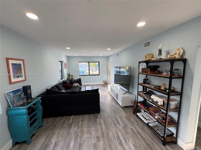 440 E 37th St, Hialeah, FL 33013 - living area with wood finished floors, recessed lighting, and baseboards