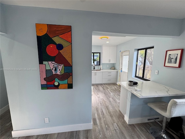 440 E 37th St, Hialeah, FL 33013 - home office featuring light wood-type flooring and baseboards