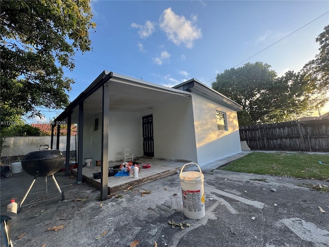 440 E 37th St, Hialeah, FL 33013 - back of property with fence, a patio, and stucco siding