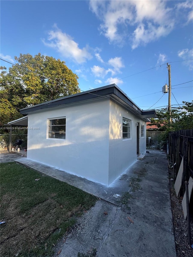440 E 37th St, Hialeah, FL 33013 - view of home's exterior with fence and stucco siding