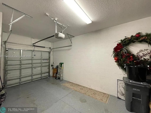 14531 Bretton Woods Trce, Delray Beach, FL 33446 - garage with a garage door opener and concrete block wall