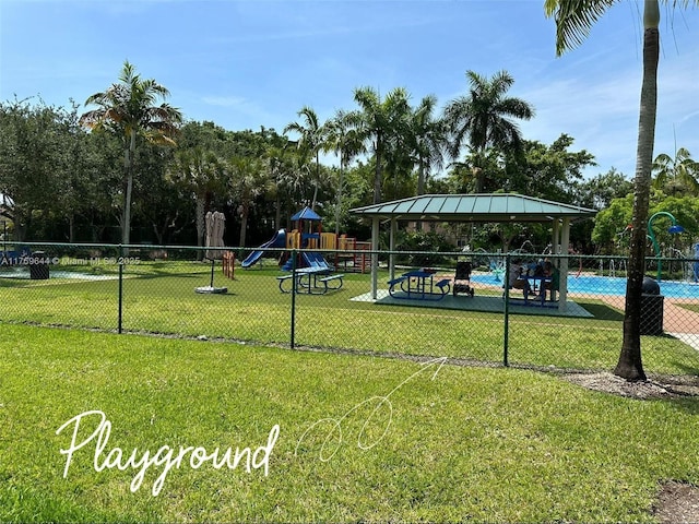 4630 NW 102nd Ave Unit 103-15, Doral, FL 33178 - view of community with a lawn, a gazebo, playground community, and fence