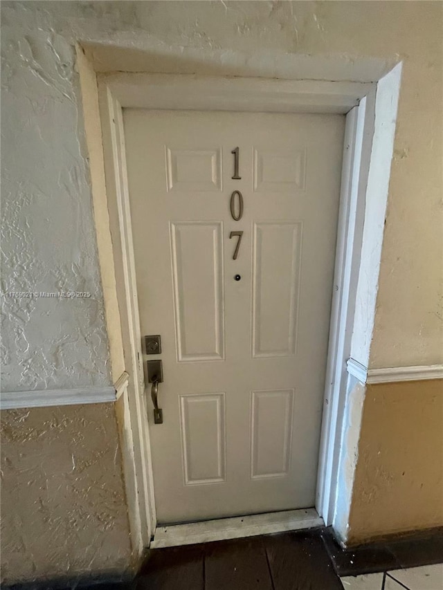 5775 W 20th Ave Unit 107, Hialeah, FL 33012 - view of exterior entry featuring stucco siding