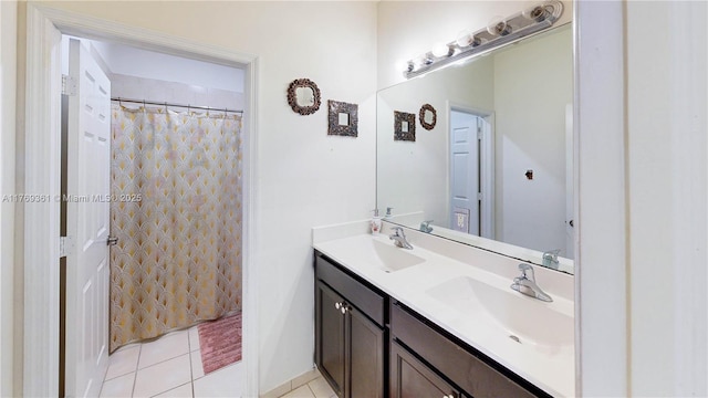 full bathroom with double vanity, a shower with shower curtain, a sink, and tile patterned flooring