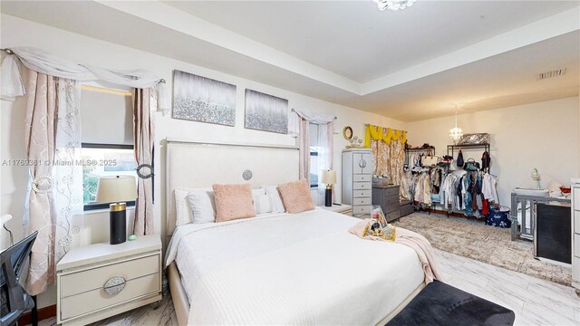 bedroom with marble finish floor and visible vents