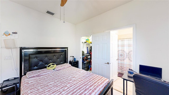 bedroom featuring visible vents, a closet, ceiling fan, and a spacious closet