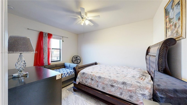 bedroom with marble finish floor and a ceiling fan