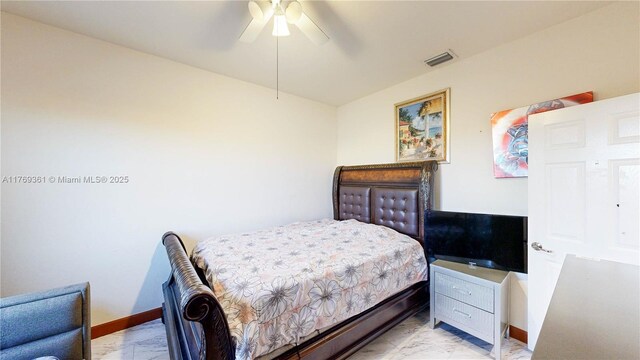 bedroom featuring a ceiling fan, marble finish floor, baseboards, and visible vents