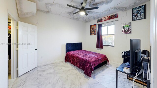 bedroom with marble finish floor, baseboards, and ceiling fan