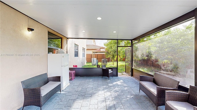 sunroom / solarium featuring an outdoor living space