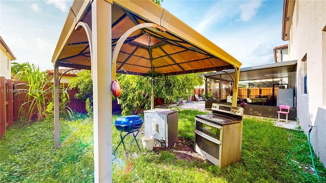 view of yard featuring a fenced backyard and a gazebo