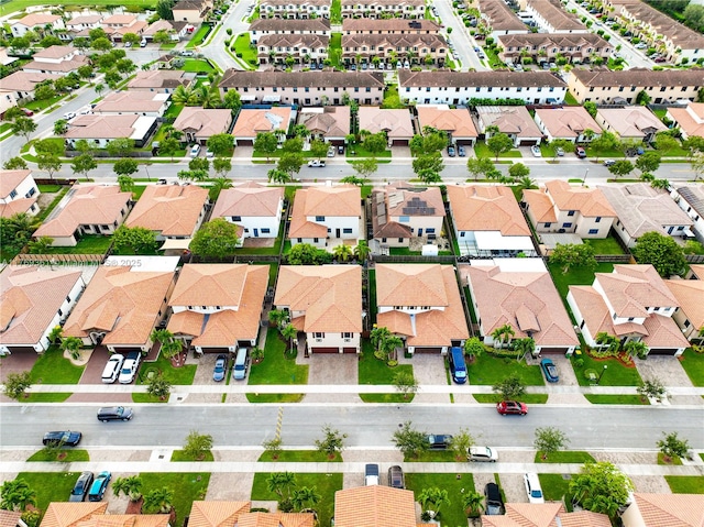 birds eye view of property with a residential view