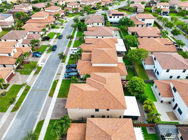 birds eye view of property with a residential view