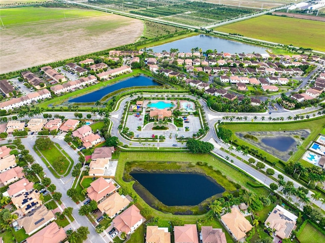 bird's eye view with a water view and a residential view