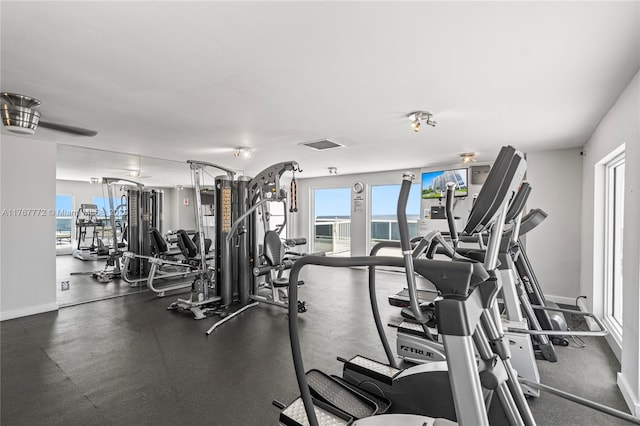 gym with baseboards and visible vents