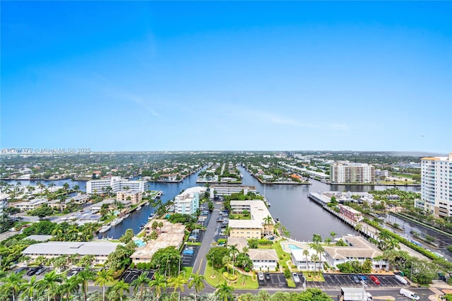 drone / aerial view featuring a water view and a view of city