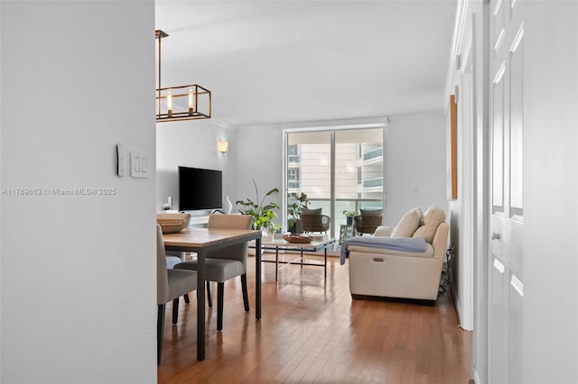 2101 Brickell Ave Unit 1809, Miami, FL 33129 - living room featuring hardwood / wood-style floors, a chandelier, and ornamental molding