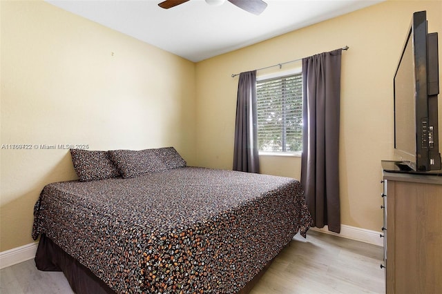3340 Palomino Dr Unit 221-2, Davie, FL 33024 - bedroom with wood finished floors, baseboards, and ceiling fan