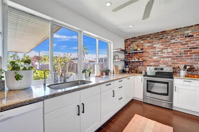 3407 N Longfellow Cir, Hollywood, FL 33021 - kitchen with stainless steel range with electric cooktop, a sink, dishwasher, white cabinets, and open shelves
