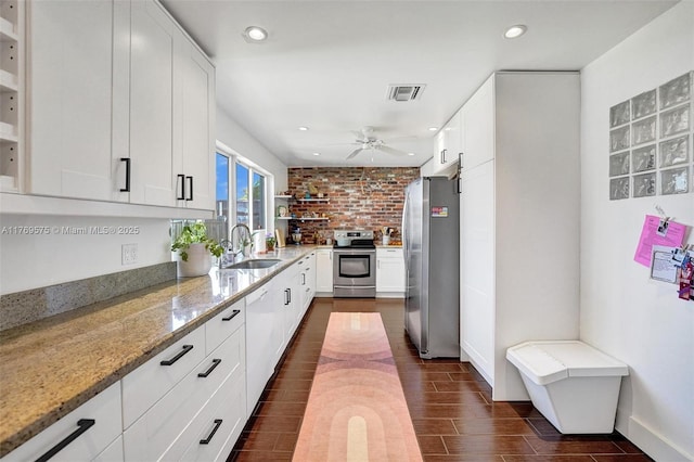 3407 N Longfellow Cir, Hollywood, FL 33021 - kitchen featuring stainless steel appliances, a sink, open shelves, light stone countertops, and recessed lighting