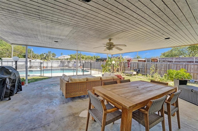 3407 N Longfellow Cir, Hollywood, FL 33021 - fenced backyard with a patio area, a grill, a ceiling fan, outdoor lounge area, and outdoor dining space