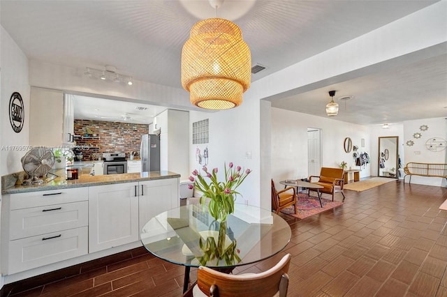 3407 N Longfellow Cir, Hollywood, FL 33021 - dining space with wood tiled floors and rail lighting