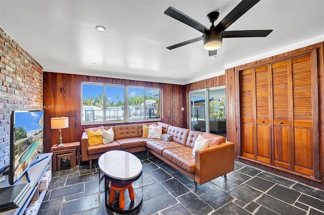 3407 N Longfellow Cir, Hollywood, FL 33021 - living area featuring stone tile flooring, wood walls, ceiling fan, and recessed lighting