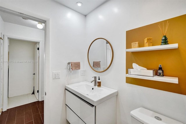 3407 N Longfellow Cir, Hollywood, FL 33021 - half bath with vanity, toilet, and wood tiled floors