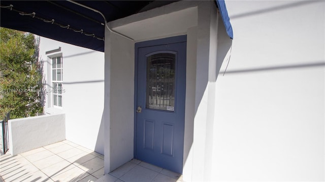 doorway to property with stucco siding