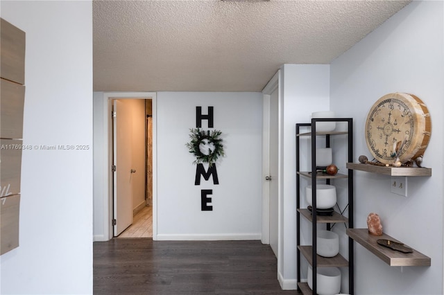 9137 Limetree Ln Unit 166, Pembroke Pines, FL 33024 - corridor featuring wood finished floors, a textured ceiling, and baseboards