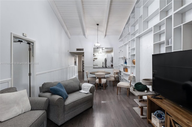9137 Limetree Ln Unit 166, Pembroke Pines, FL 33024 - living room featuring wood finished floors, built in shelves, wainscoting, beamed ceiling, and wooden ceiling