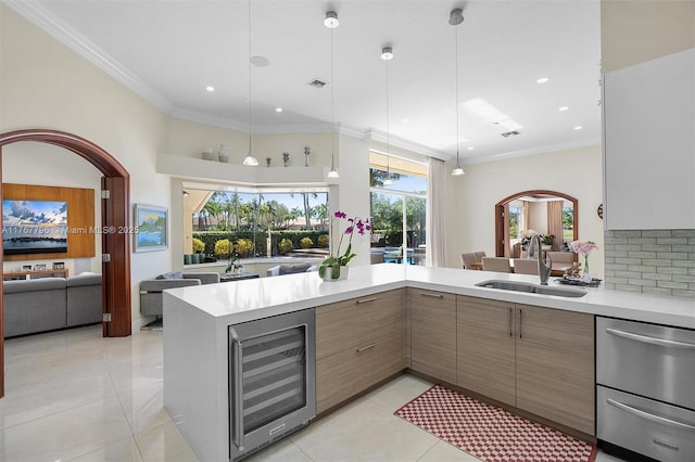 2541 Golf View Dr, Weston, FL 33327 - kitchen with wine cooler, light countertops, a sink, modern cabinets, and light tile patterned floors