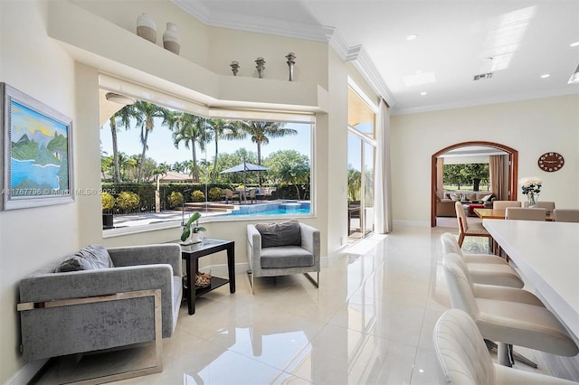 2541 Golf View Dr, Weston, FL 33327 - sitting room featuring light tile patterned flooring, ornamental molding, baseboards, recessed lighting, and arched walkways
